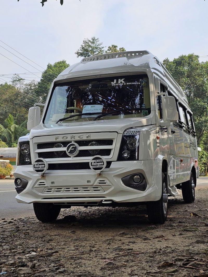 The tempo traveller photographed from the front, ready to depart